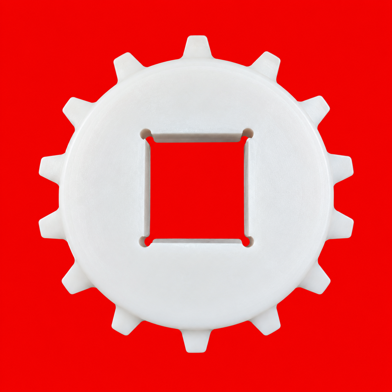 Engranaje blanco sobre fondo rojo
